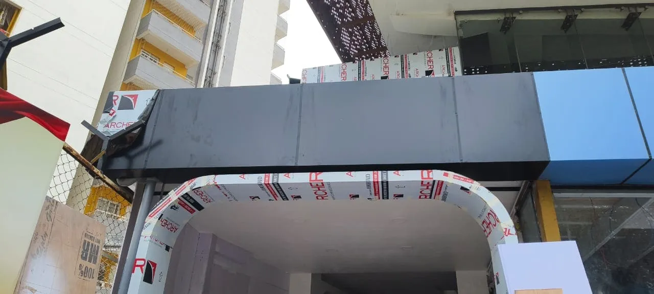ACP cladding arch entrance being fabricated for a commercial shop front under construction in Bangalore using Archer ACP panels