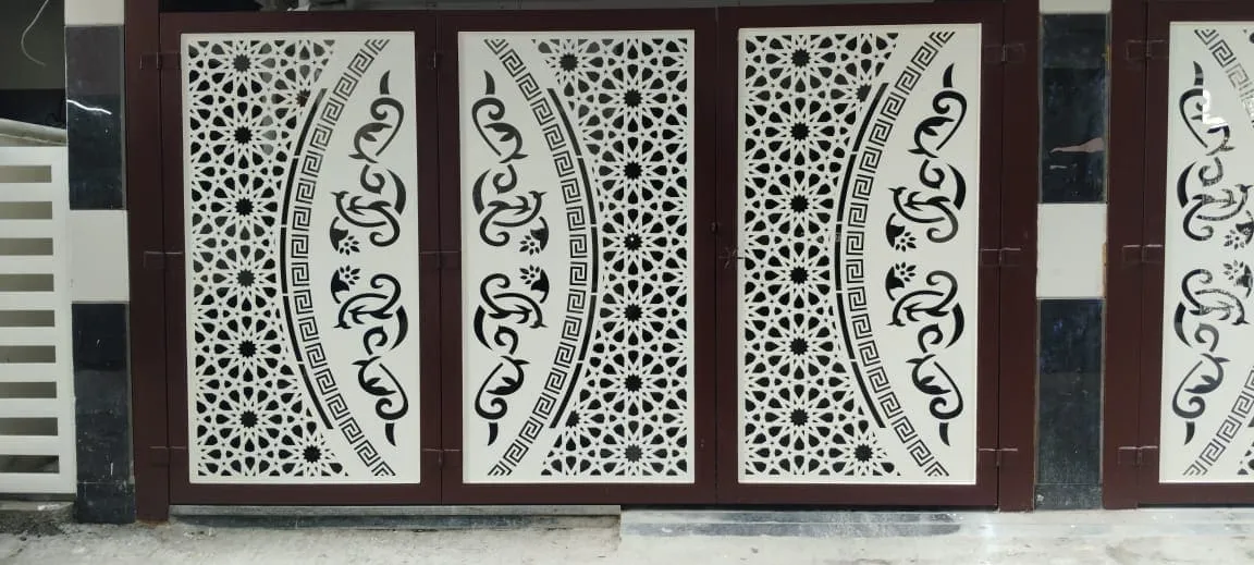 Close-up of white CNC laser cut mild steel gate panels with intricate Arabic geometric and floral patterns in Bangalore